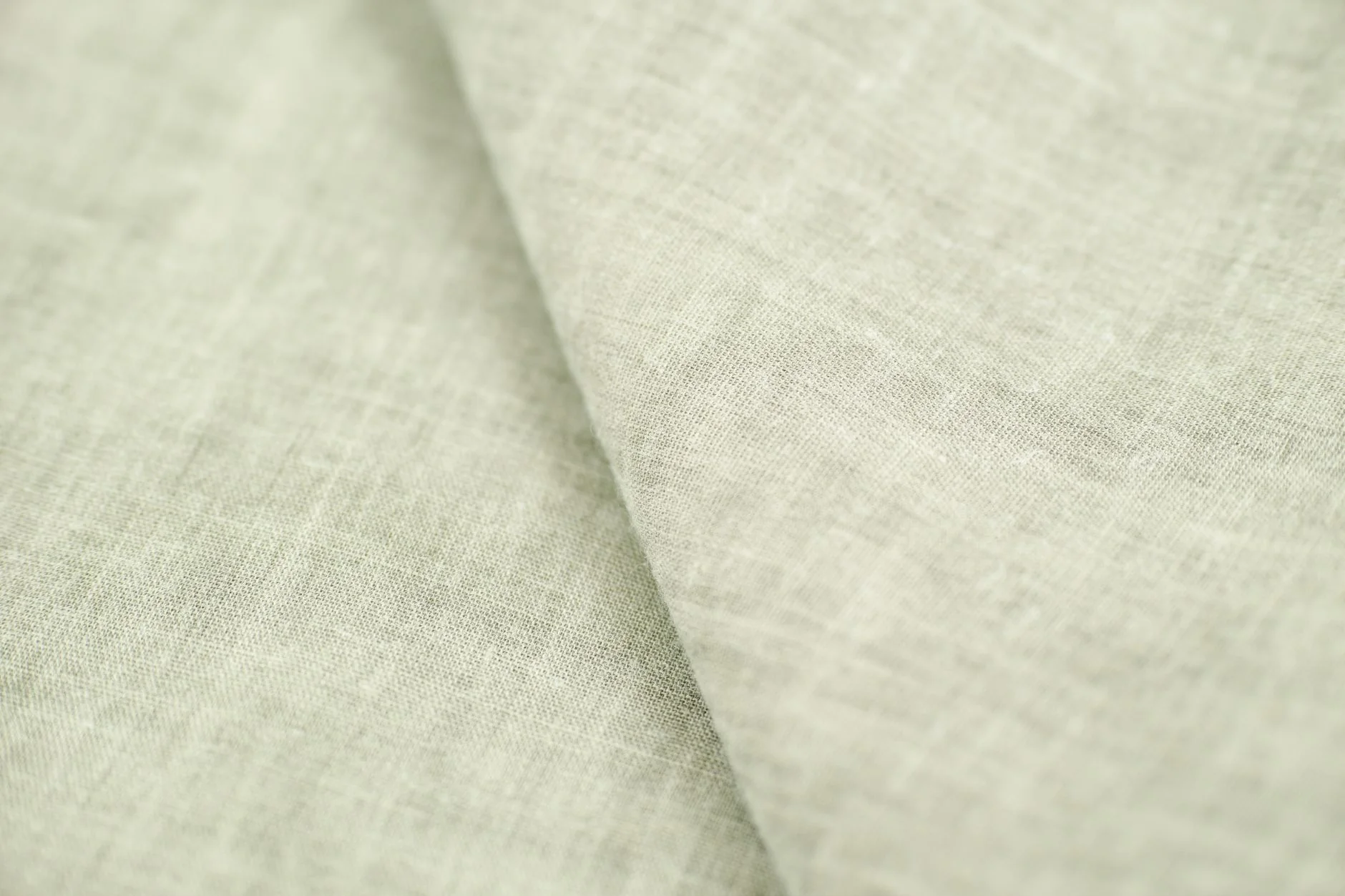 Soft linen fabric texture representing comfort-first sizing and gentle body-safe materials