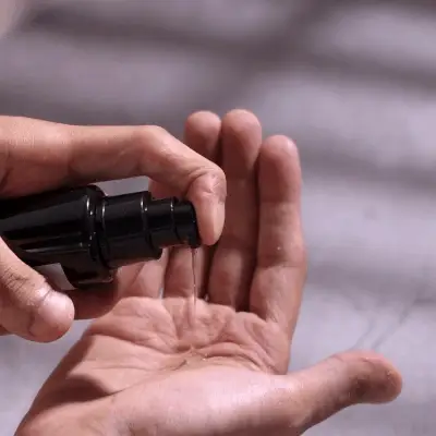 Pouring lube on hand