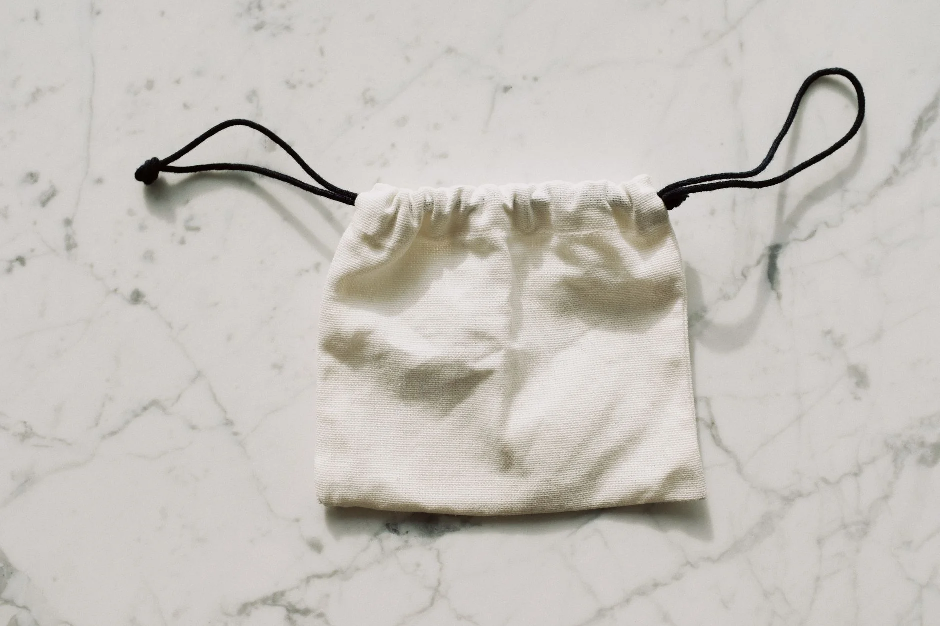 Clean fabric drawstring pouch for separate, dust-free toy storage