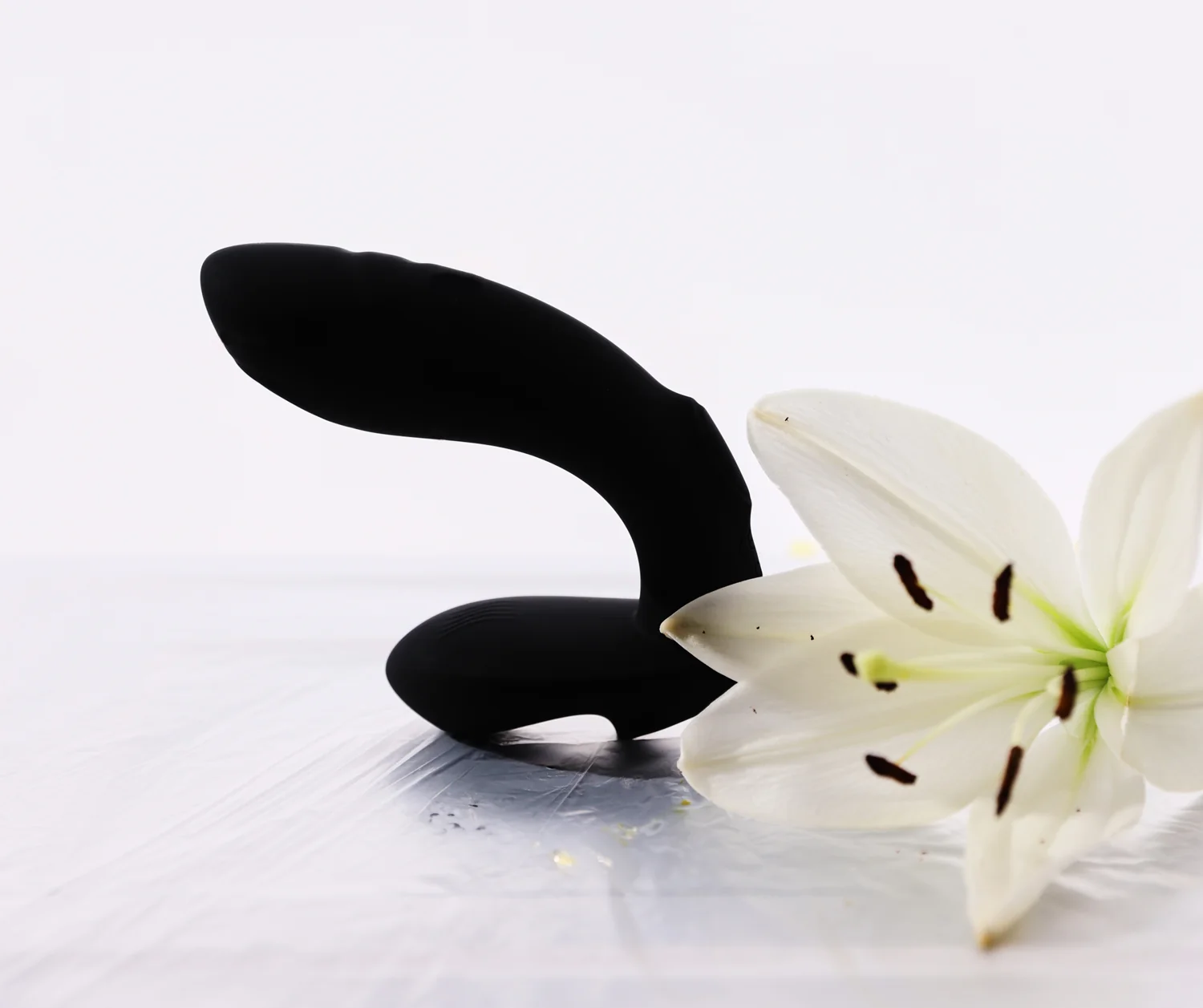 Ralf and a white lily on a light gray background