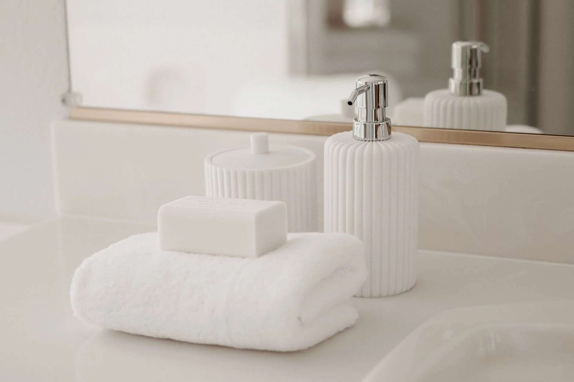 White soap bar and fresh towel in a clean bathroom, representing toy cleaning and hygiene routine