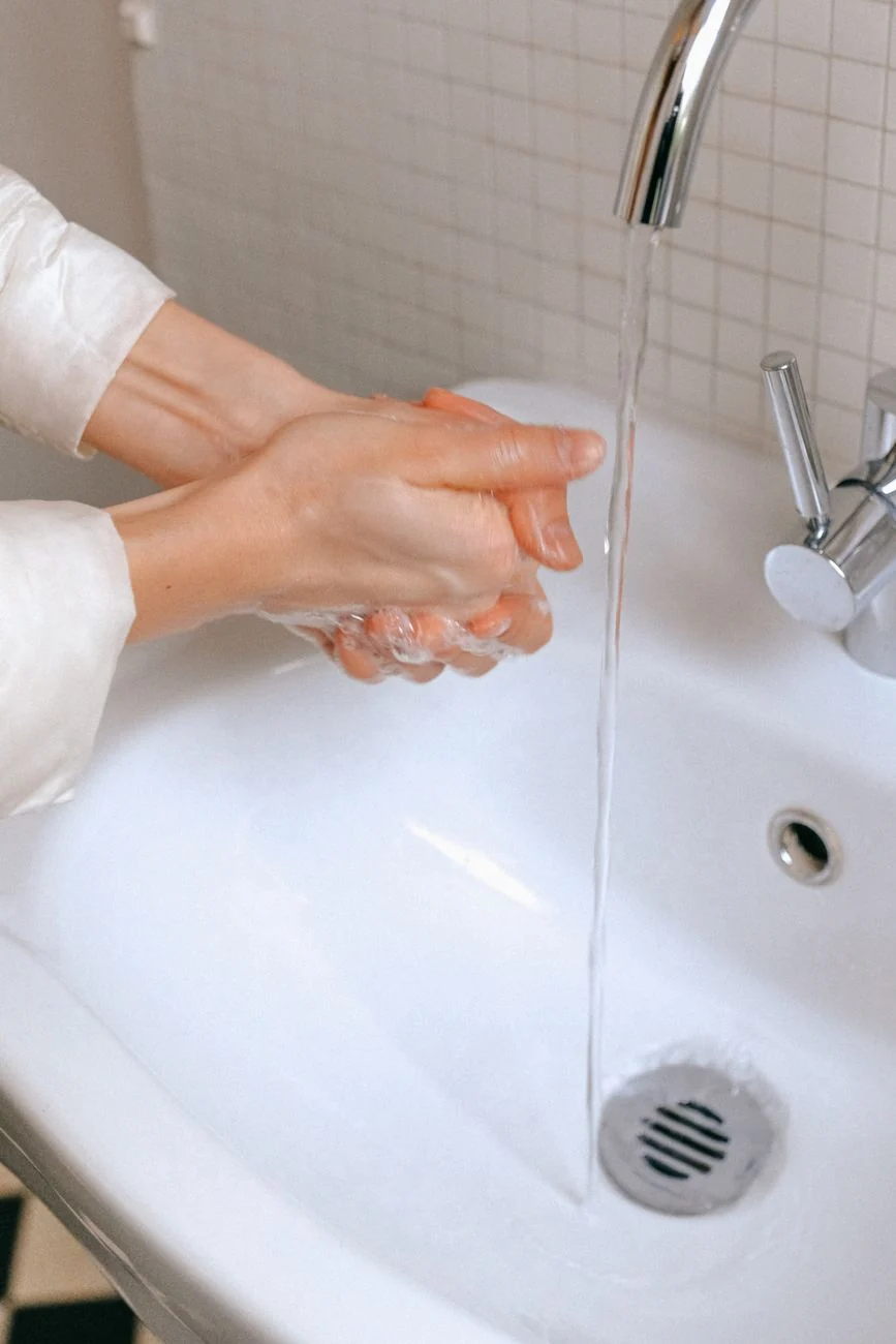 Hands washing with soap and water — hygiene comes first before safe pump use