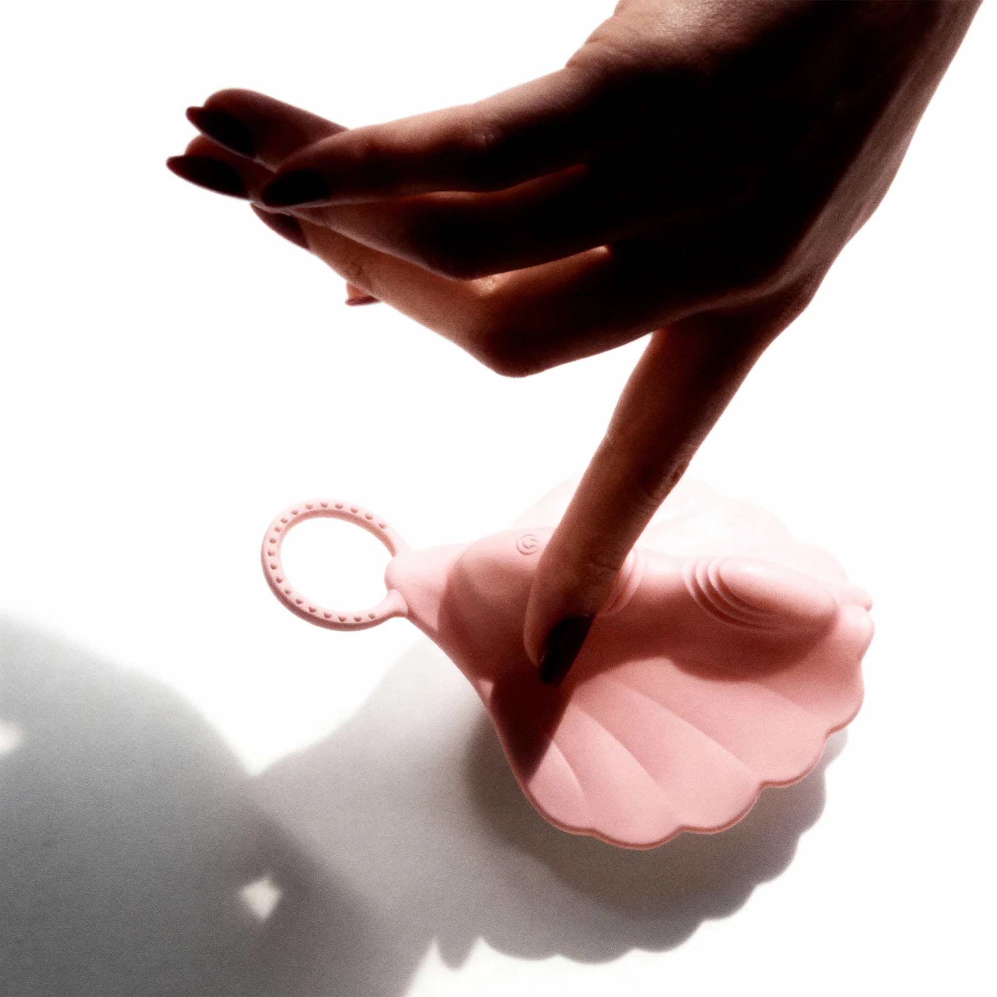 Sophia grinding vibrator floating in a pool of water