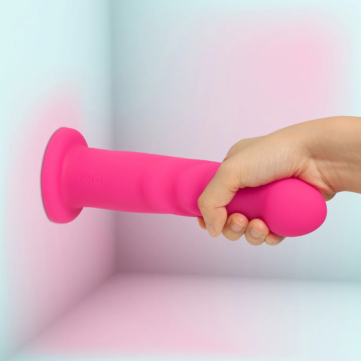 Hand demonstrating Renee's suction cup power against a wall
