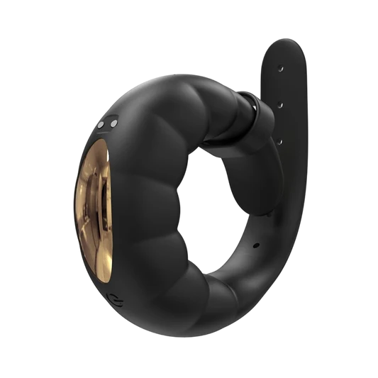 Black and gold cock ring on a white background