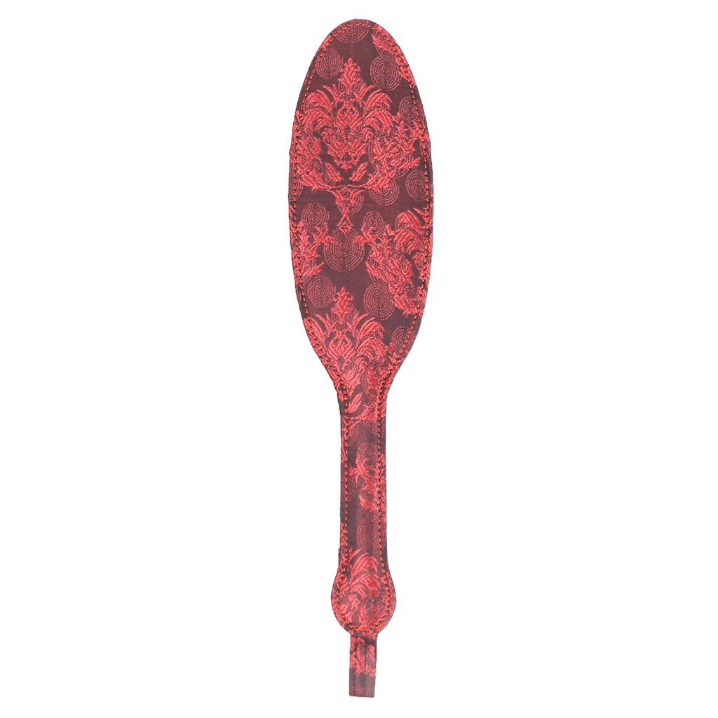 Decorative paddle with red vintage floral pattern on a white background
