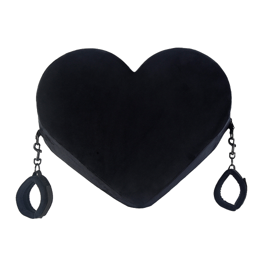 Black heart-shaped pillow with cuffs
