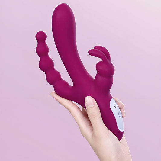 Hand holding up Joker against a purple backdrop