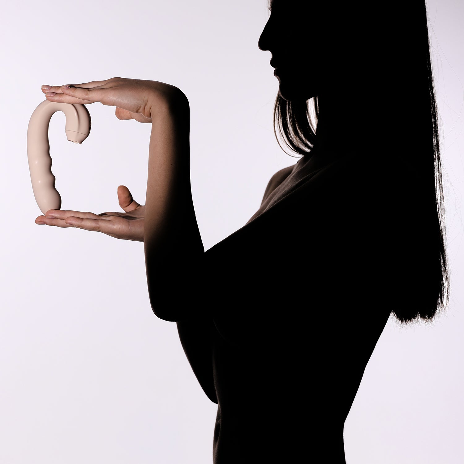 Silhouette of a person holding Triple Vibe against a white background