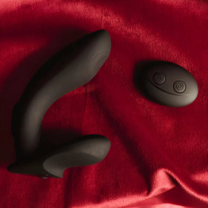 Ralf vibe and remote control on a dark red silk cloth